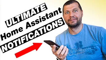 Me holding a phone with ultimate Home Assistant notifications label