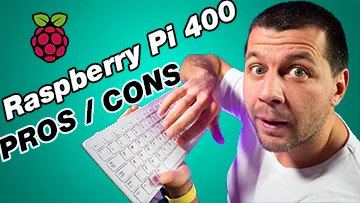 Kiril Peyanski holding a raspberry pi 400 with a label raspberry pi 400 pros / cons