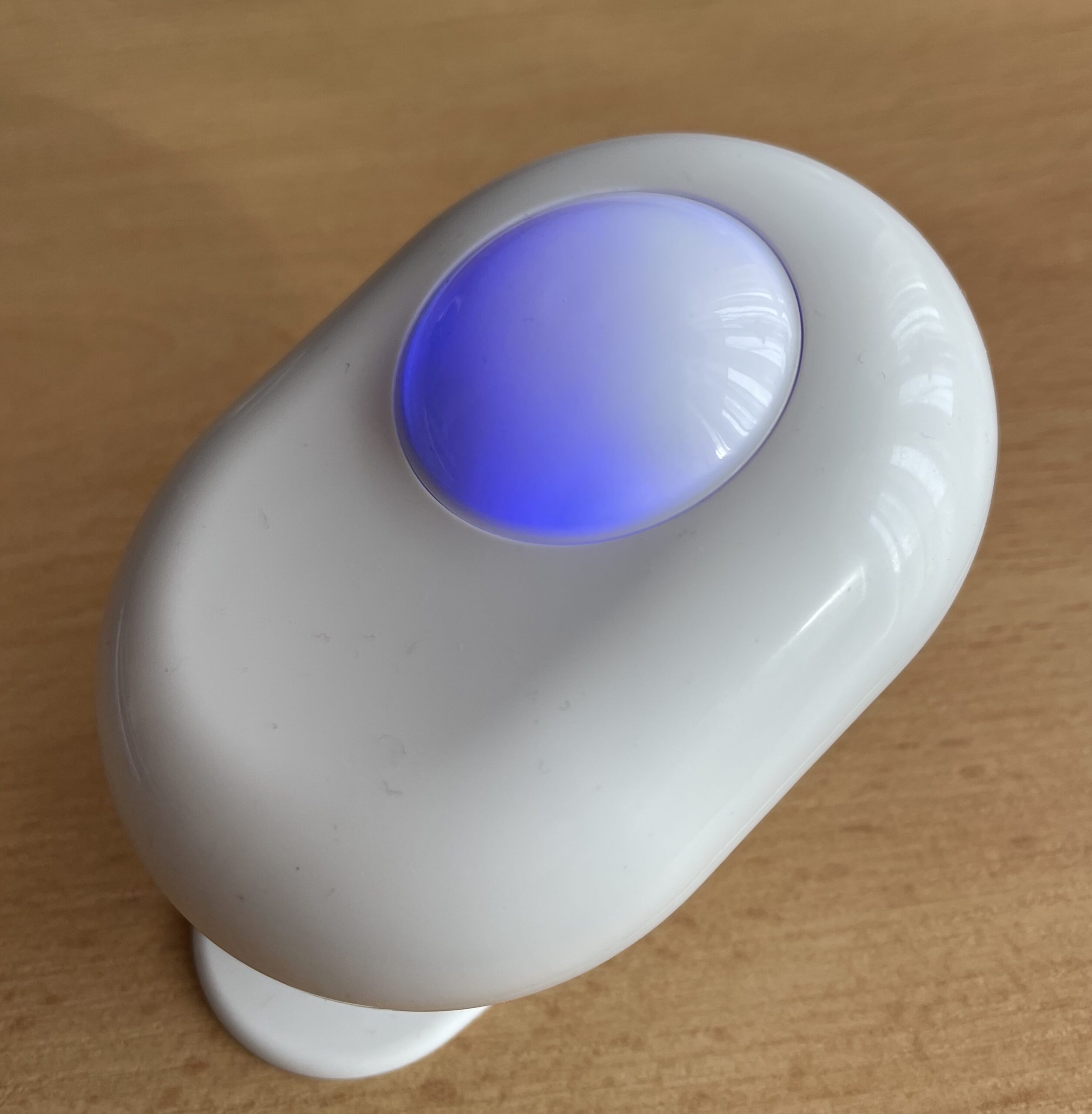 Shelly Motion Sensor picture with the LED glowing in blue