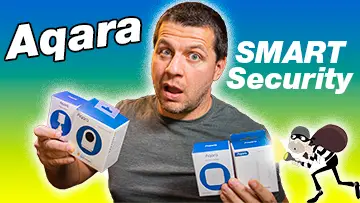 Aqara Smart Security - Kiril Peyanski holding aqara camera hub g2h, vibration sensor, motion sensor, door and window sensor