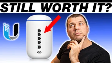 Kiril Peyanski looking at still worth it label with UDM picture and Ubiquiti logo aside