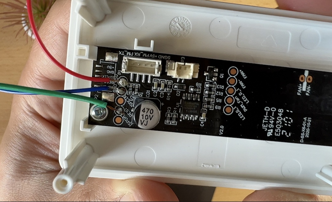 Soldering some wires to the Vindriktning board