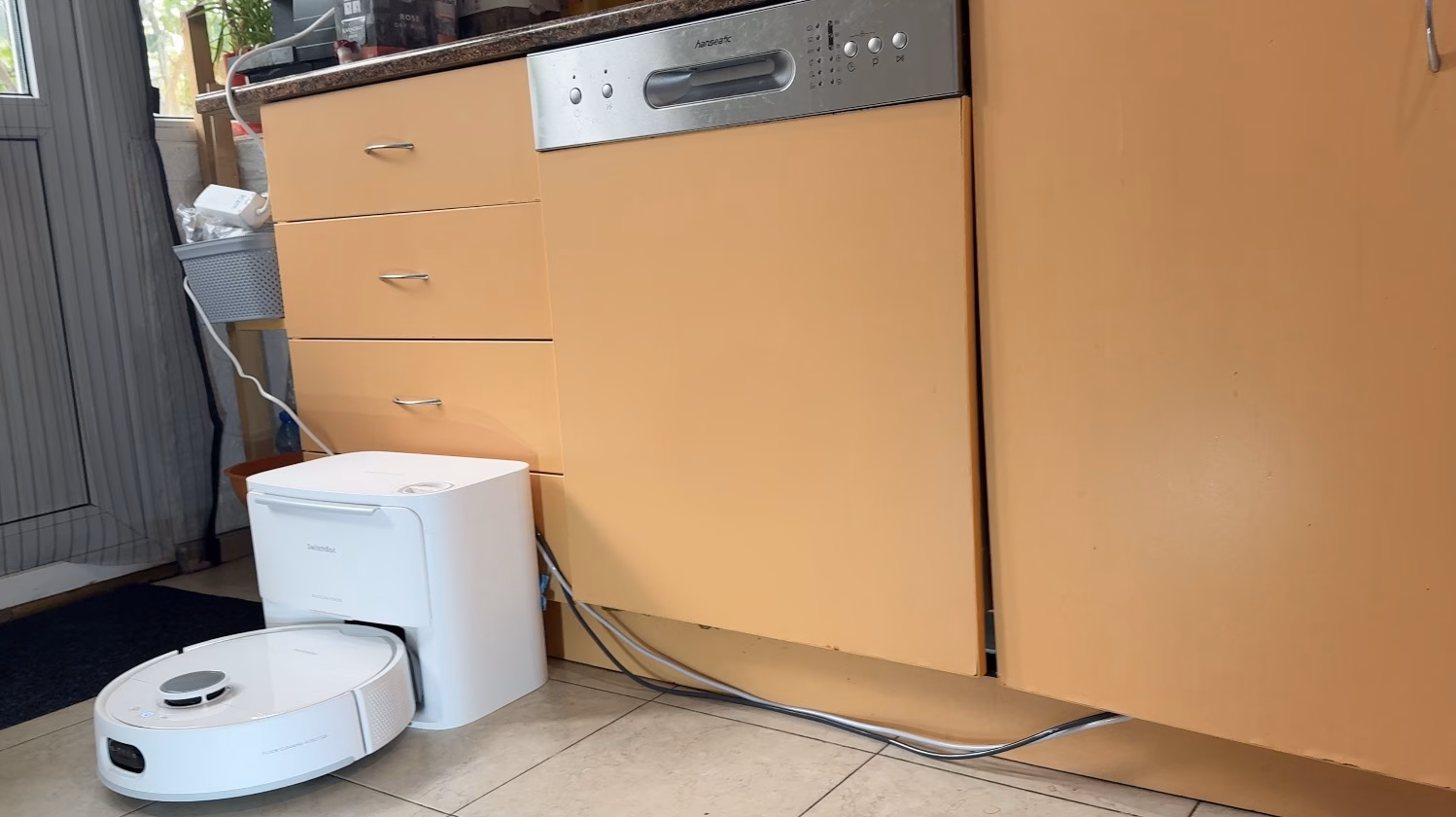 Not the prettiest setup due to visible pipes, but that is not only valid for SwitchBot S20. You need a special kitchen design to hide them or to drill some holes